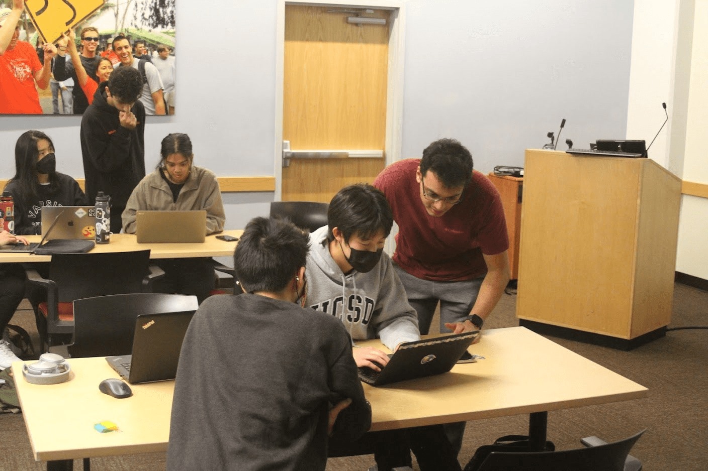 ACM Hack president Nikhil helps someone at a Hack Event